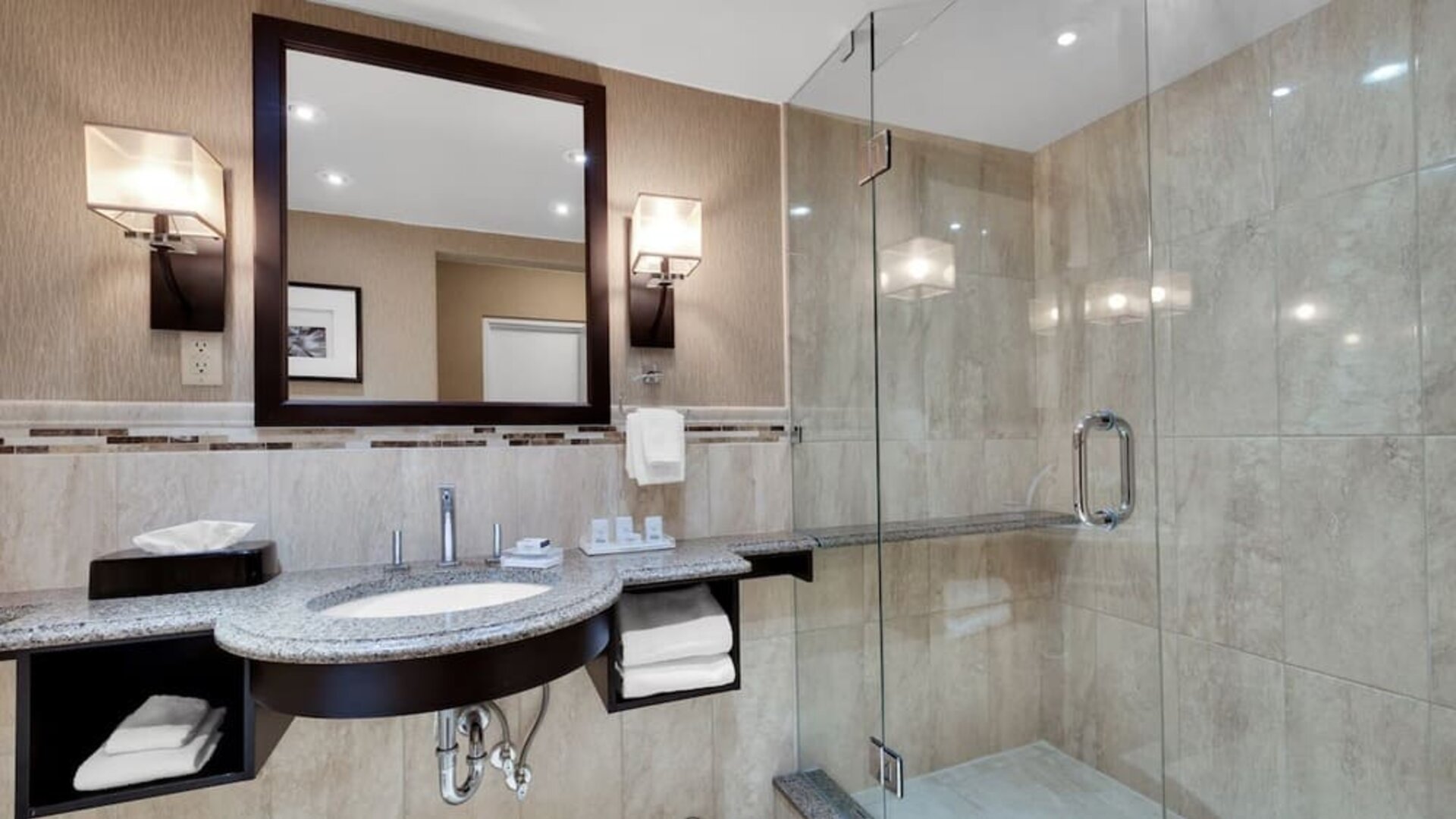 Guest bathroom with shower at Holiday Inn Peterborough-Waterfront.