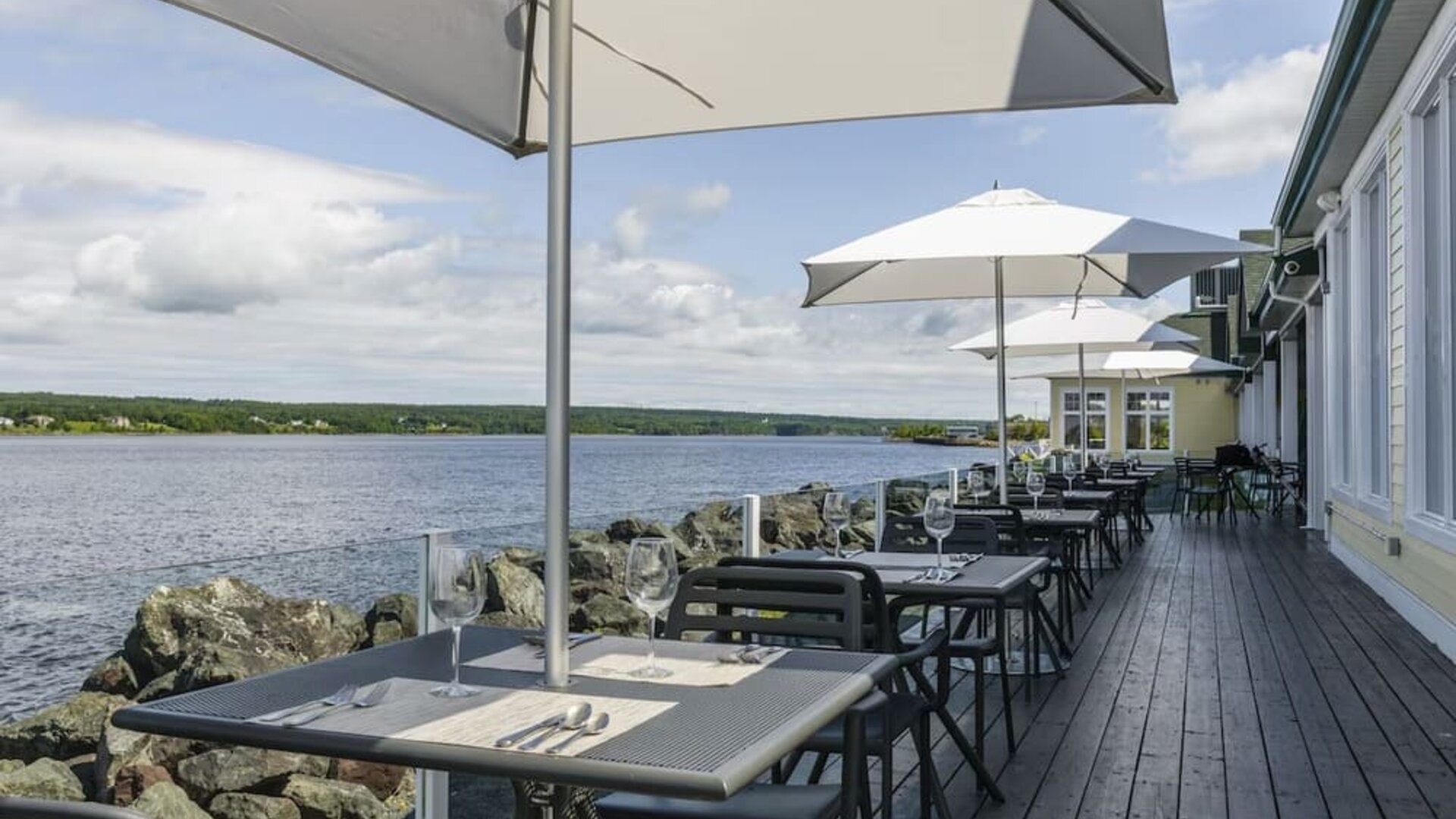 Terrace sitting area with beautiful view at Rodd Miramichi River.
