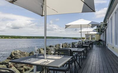 Terrace sitting area with beautiful view at Rodd Miramichi River.