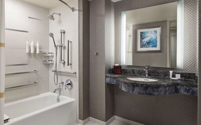 Guest bathroom with shower and tub at Crystal Gateway Marriott.