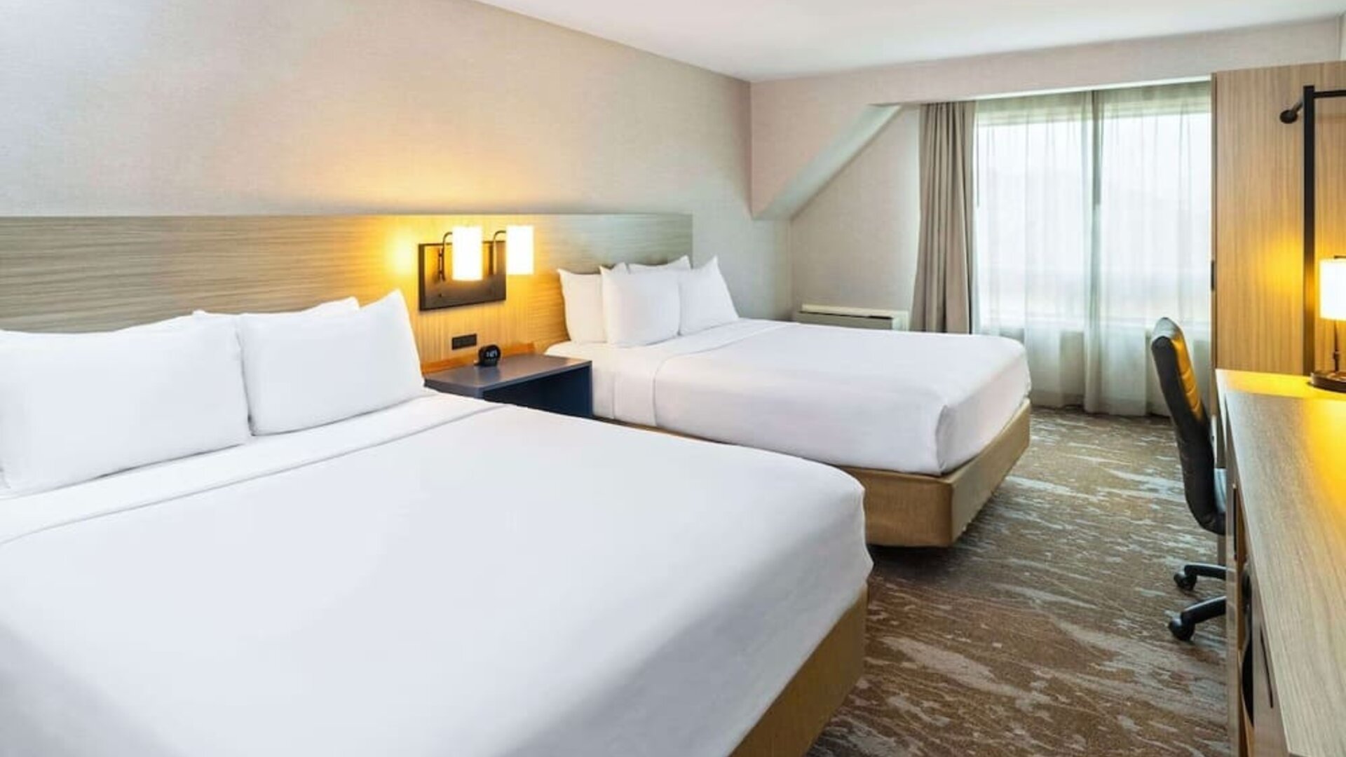 Bright and spacious day use twin room with work desk at Comfort Inn Moncton Magnetic Hill.