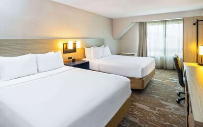 Bright and spacious day use twin room with work desk at Comfort Inn Moncton Magnetic Hill.