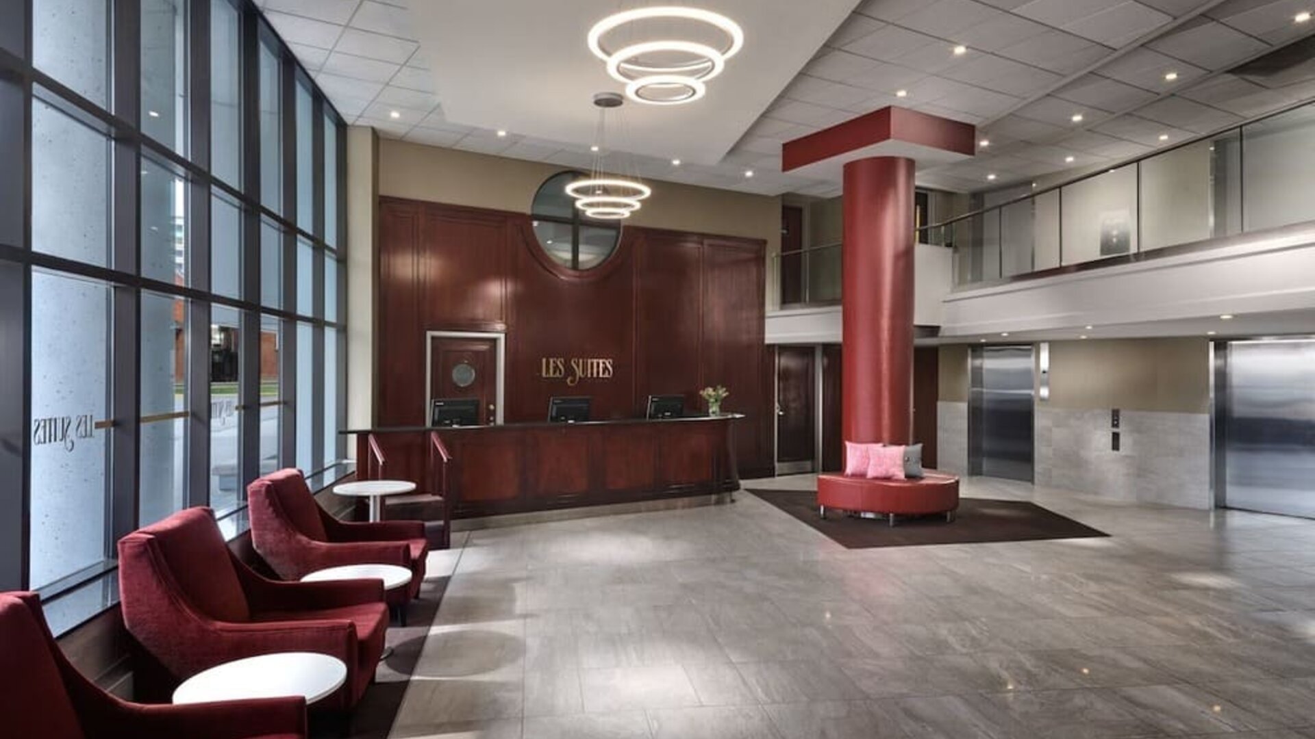 Lobby lounge with comfortable seating at Les Suites Hotel Ottawa.