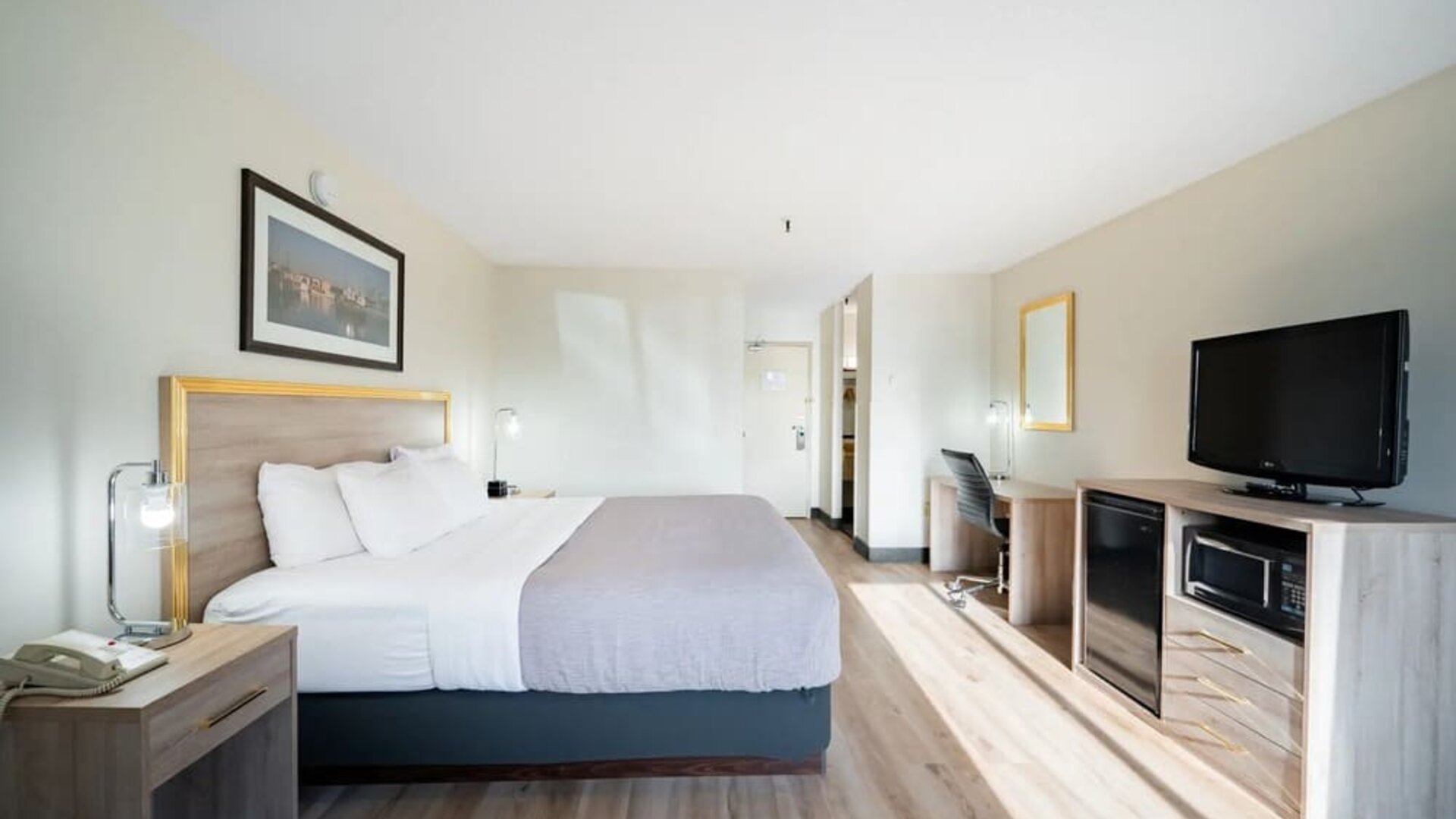 Bright and spacious day use room with TV and work desk at Halifax Airport Hotel.