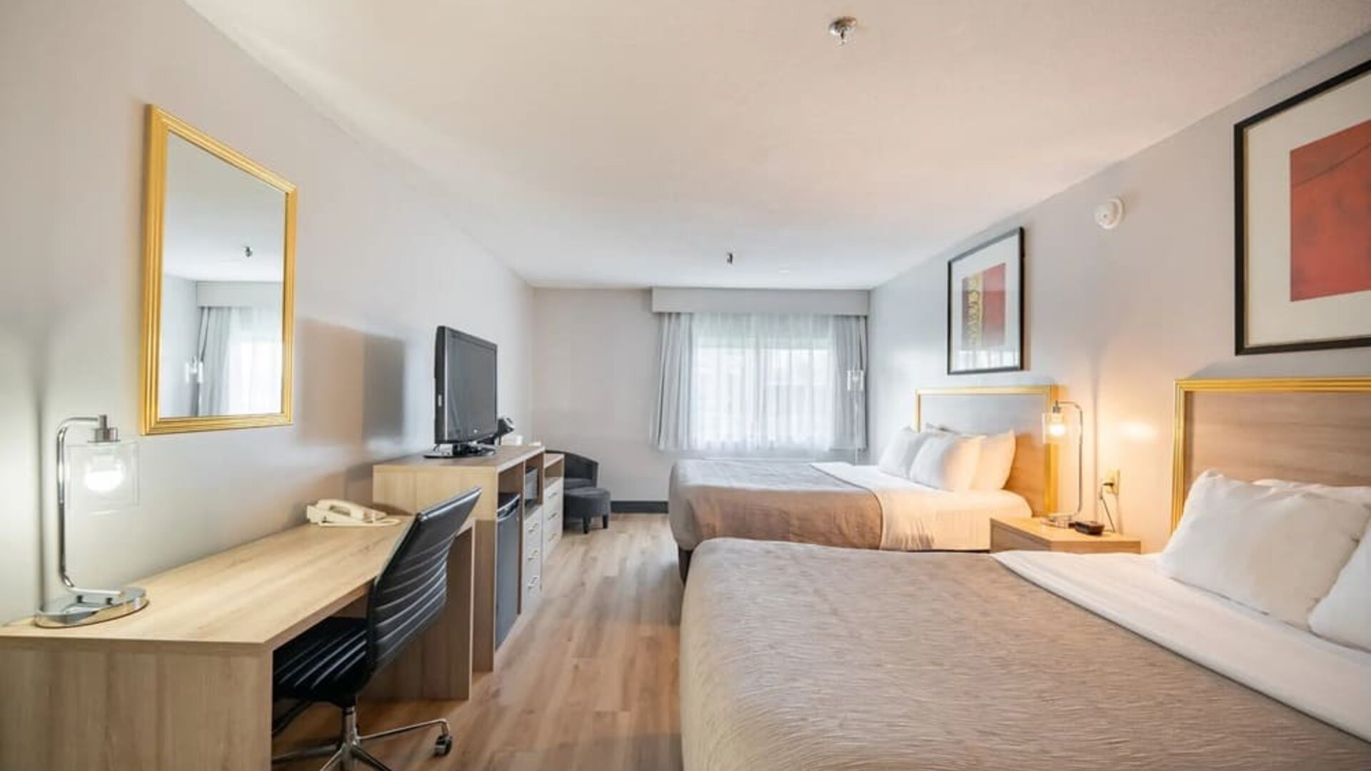 Bright and spacious day use twin room with work desk at Halifax Airport Hotel.