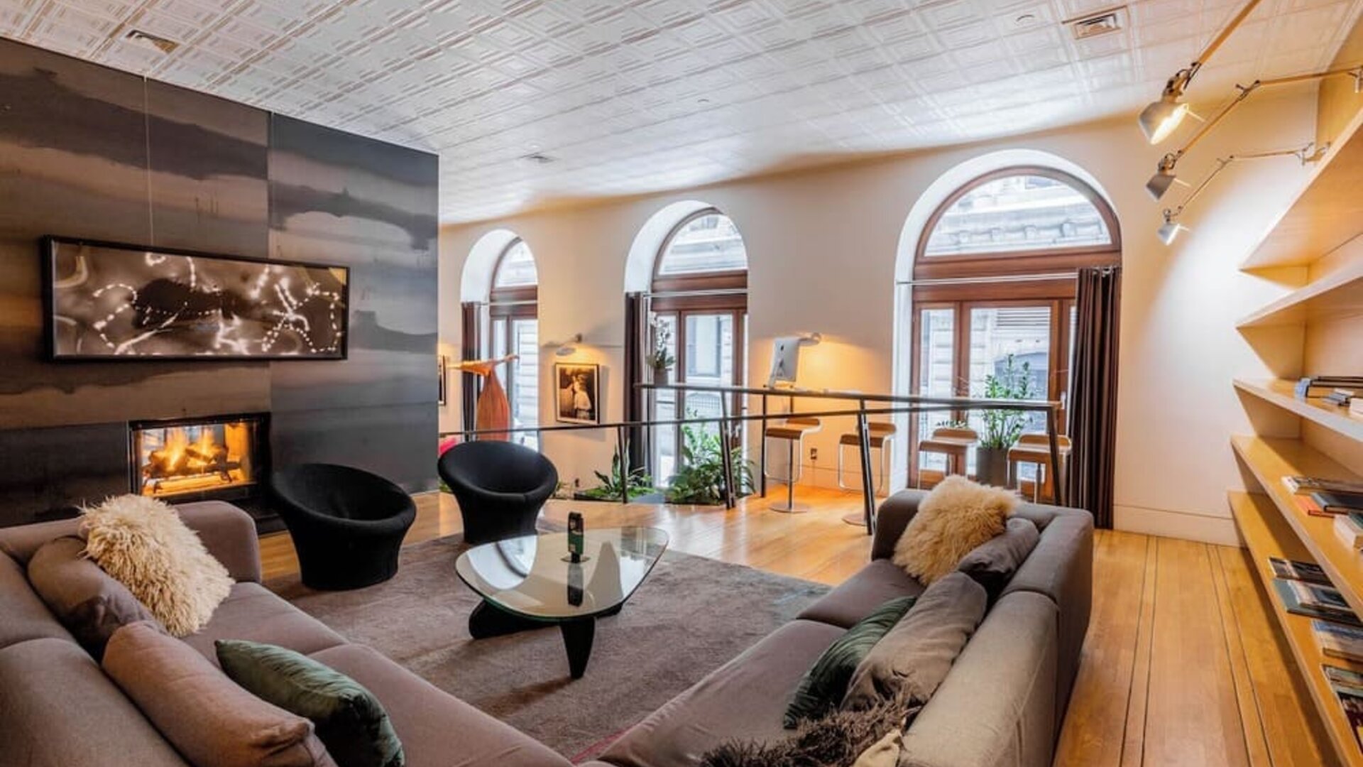 Lobby lounge with fireplace and workspace at Hotel Gault.