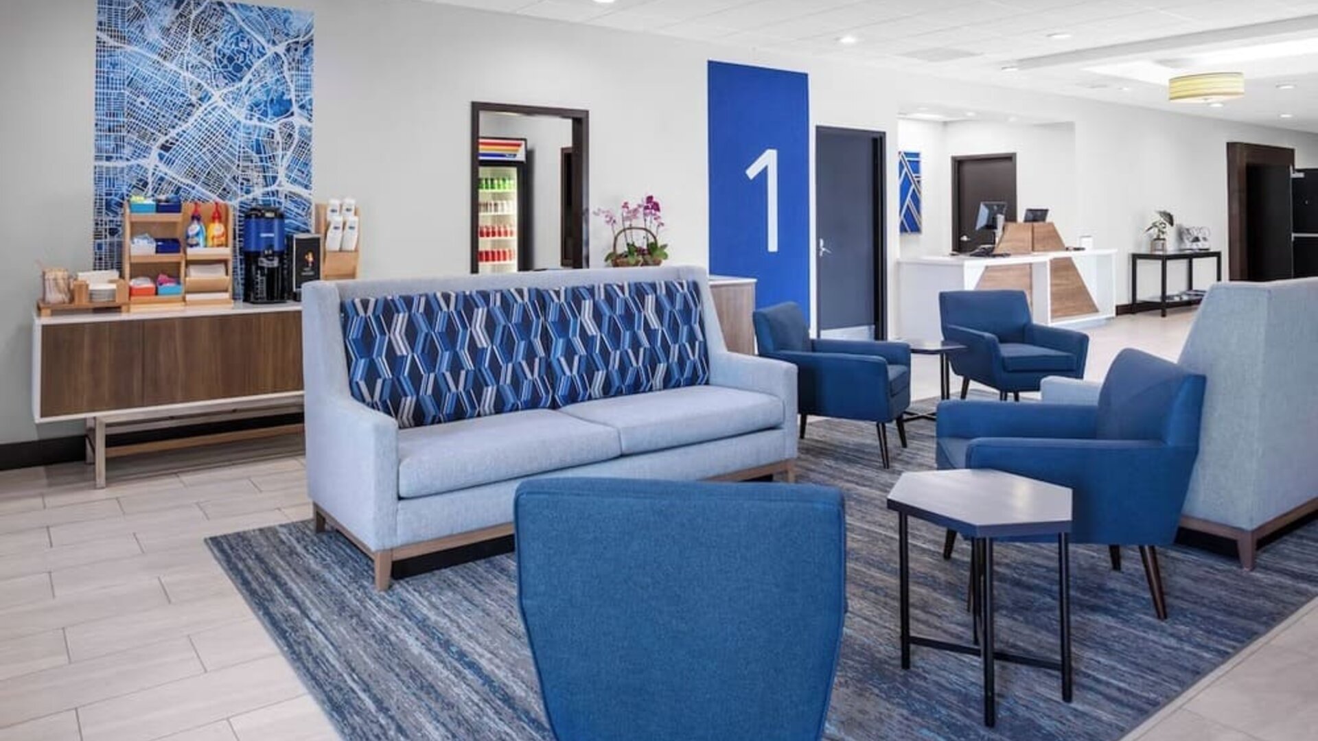 Lobby and coworking lounge at Holiday Inn Express & Suites Hermosa Beach.