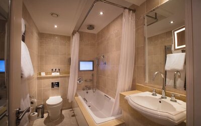 Guest bathroom with tub at The Royal Horseguards Hotel.