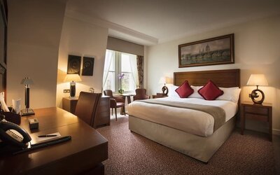 Day use room with work desk and lounge sitting at The Royal Horseguards Hotel.