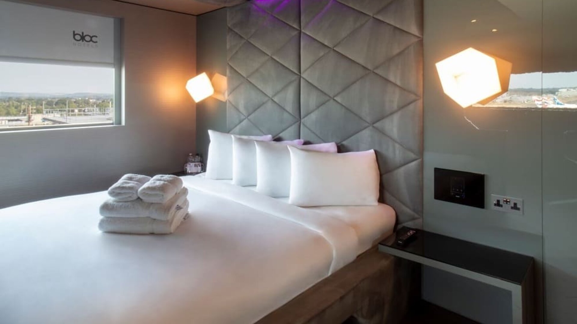 Queen bed at Bloc Hotel.