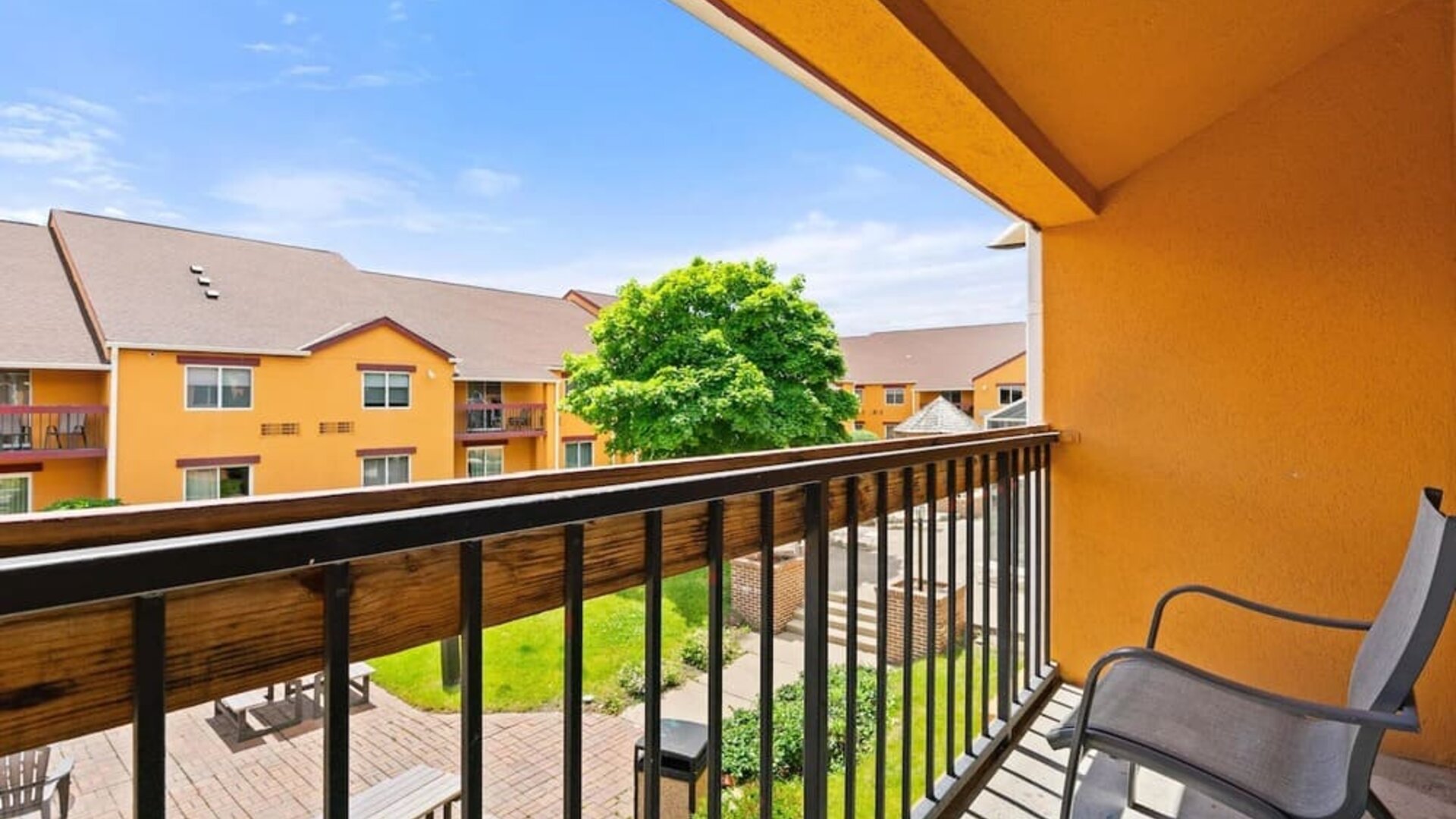 Balcony inside day use room at Chicago Club Inn & Suites.