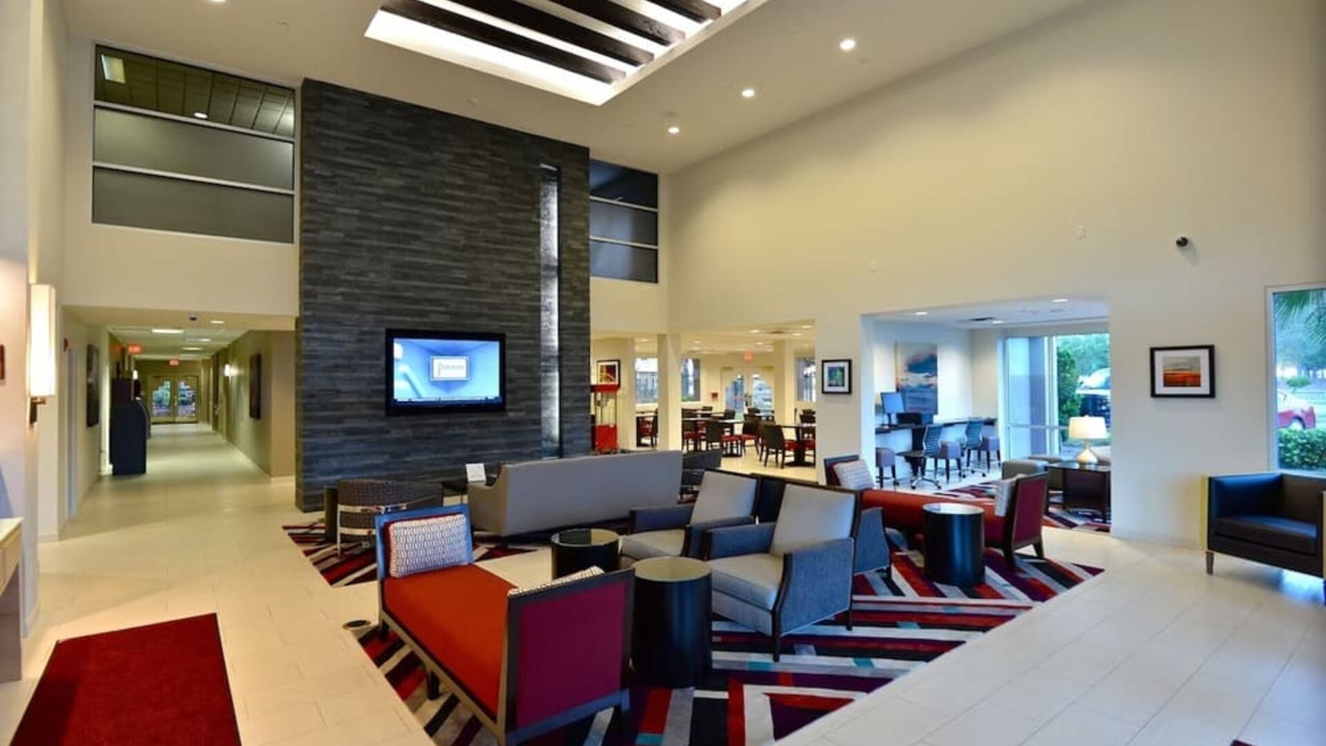 Lobby and coworking lounge at Hawthorn Suites By Wyndham El Paso Airport.