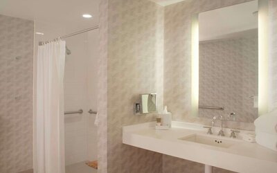 Guest bathroom with shower at Hyatt Regency Los Angeles International Airport.