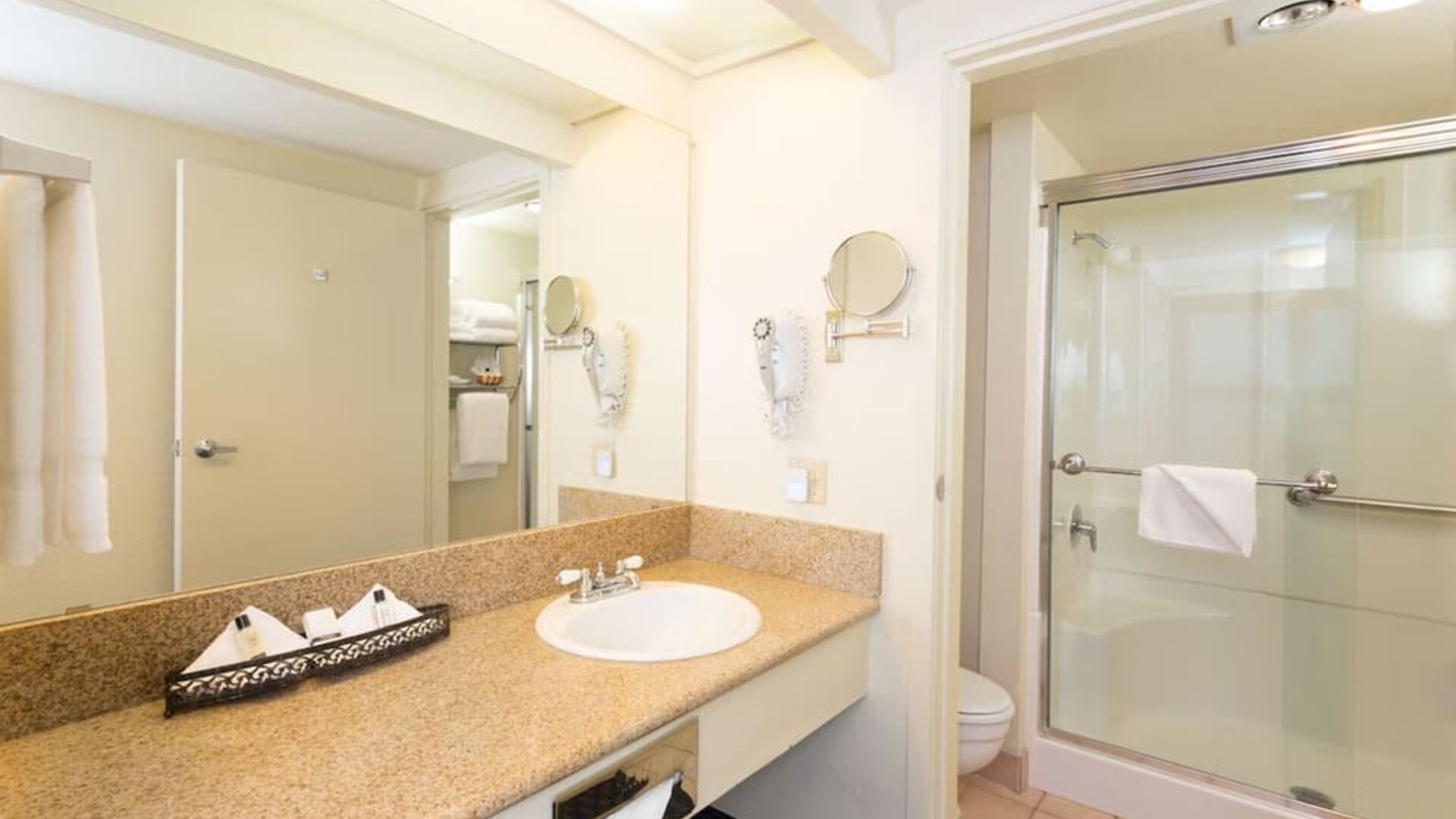 Guest bathroom with shower at The Marina Inn On San Francisco Bay.