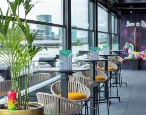 Rooftop terrace with lounge sitting at NYX Hotel London Holborn By Leonardo.
