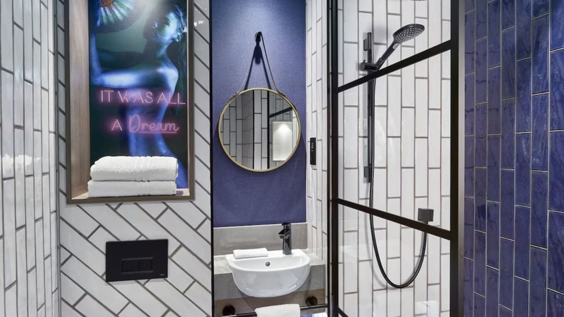 Guest bathroom with shower at NYX Hotel London Holborn By Leonardo.