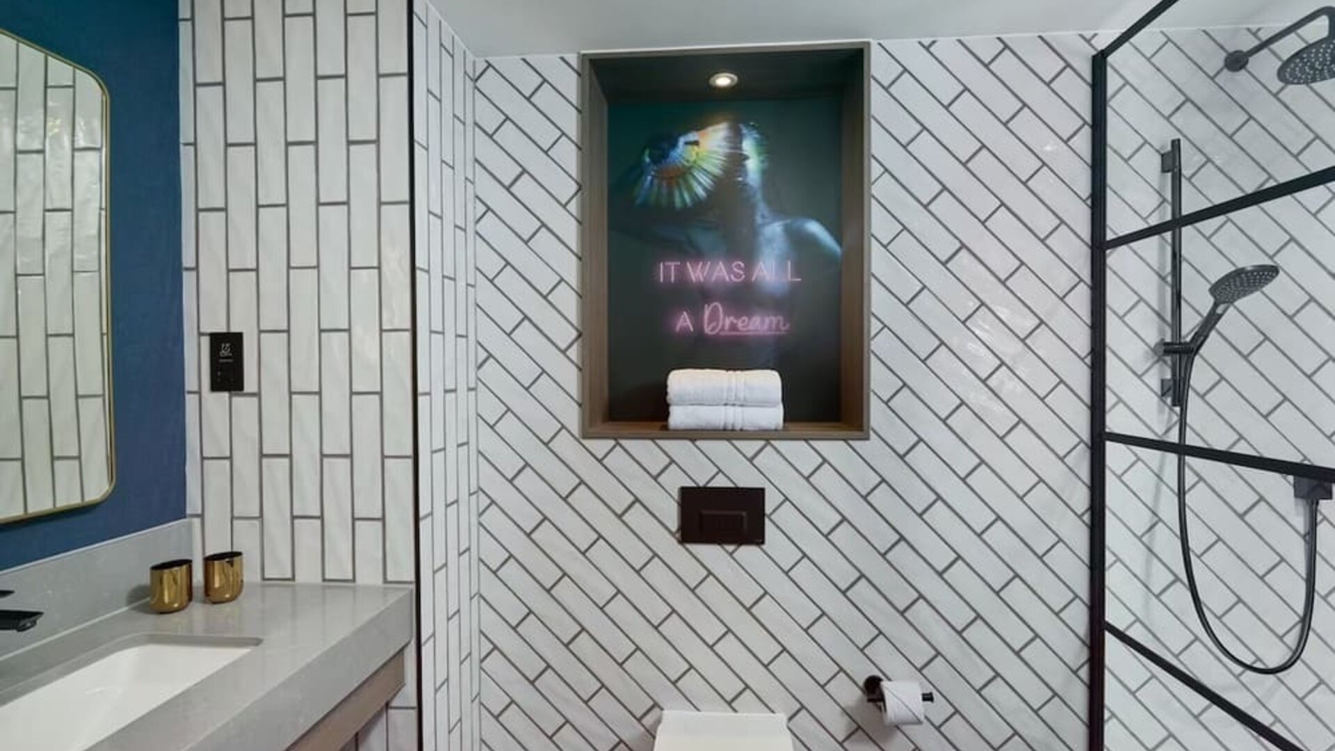 Guest bathroom with shower at NYX Hotel London Holborn By Leonardo.