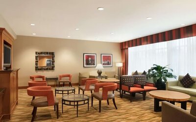 Lounge seating at Hampton Inn New York - LaGuardia Airport.
