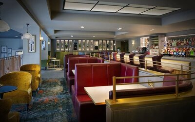 Hotel bar with comfortable seating, perfect for co-working at Leonardo Royal Hotel London City.