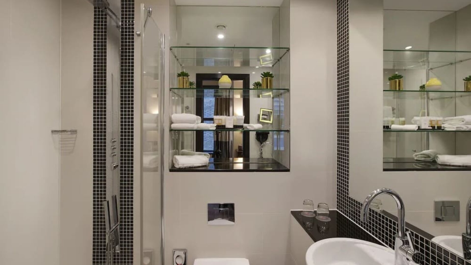 Guest bathroom with shower and free toiletries at Leonardo Royal St Paul's Hotel.