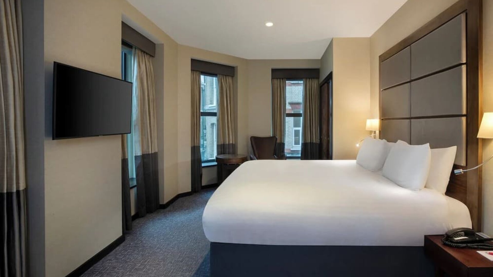 Standard room with TV screen at Leonardo Royal St Paul's Hotel.