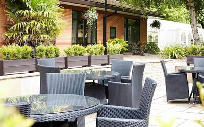 Hotel terrace with comfortable seating at Novotel Manchester West.