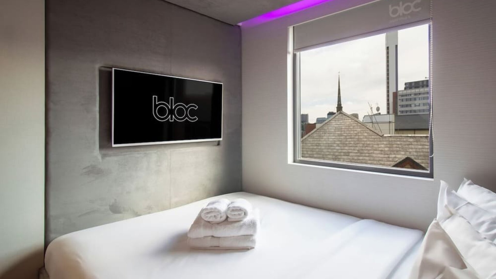 Day use room with TV screen and city view at Bloc Hotel Birmingham.