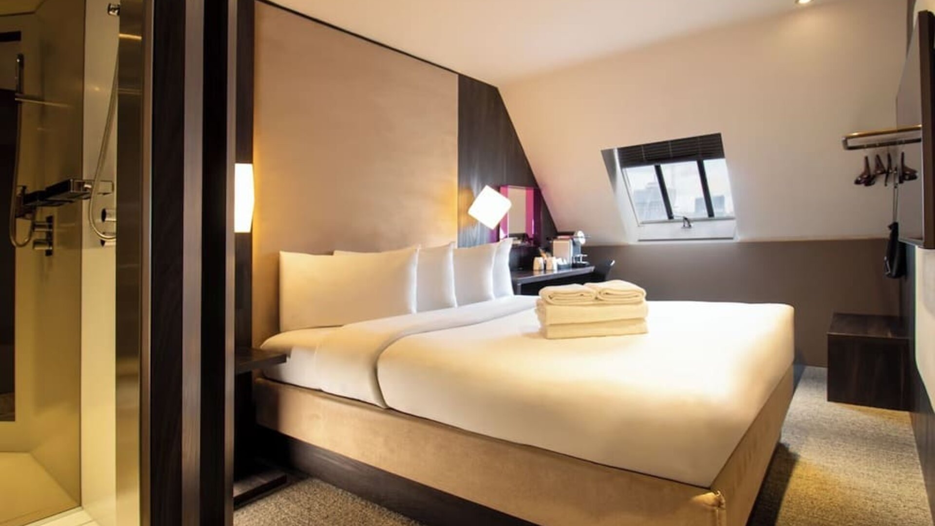Day use room with king bed and private bathroom with shower at Bloc Hotel Birmingham.