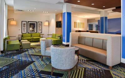 Lobby and coworking lounge at Holiday Inn Express & Suites Ottumwa.