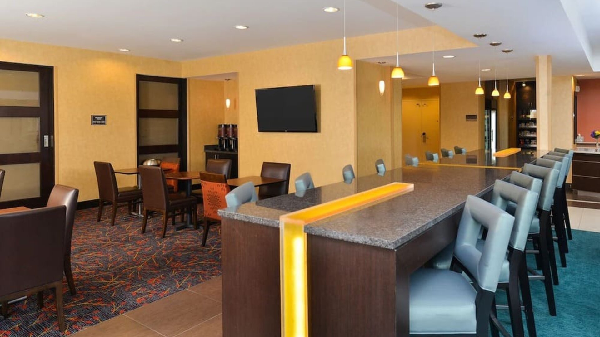Dining area perfect for coworking at Residence Inn Champaign.