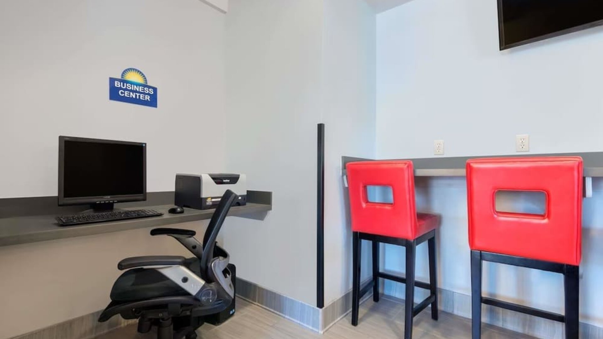 Business center with computer and printer at Hotel 1550 SFO.