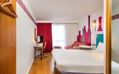 Day use family room with work desk and convertible sofa at Ibis Styles Barnsley.