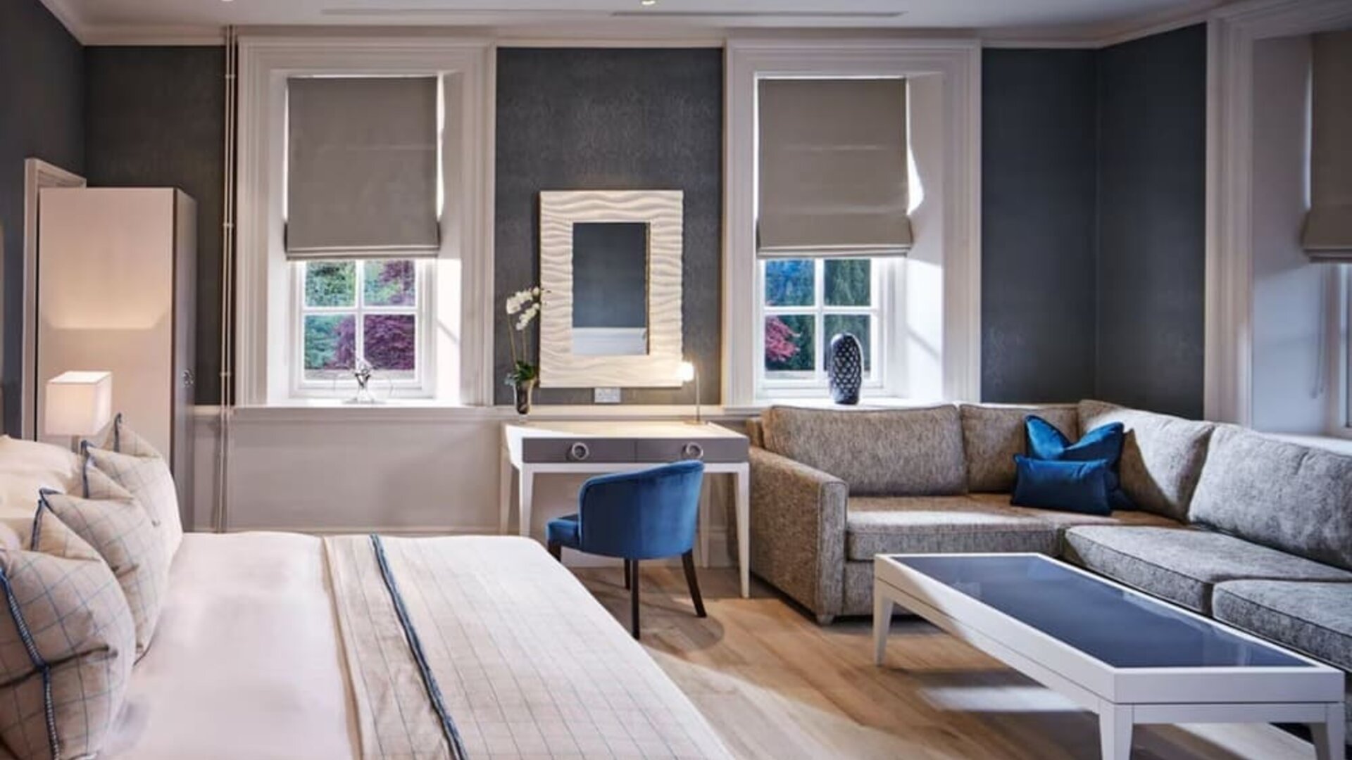 Day use studio suite with work desk and living area at Barnett Hill Hotel.