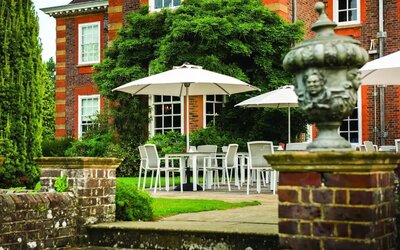 Outdoor lounge with beautiful view of the garden at Barnett Hill Hotel.