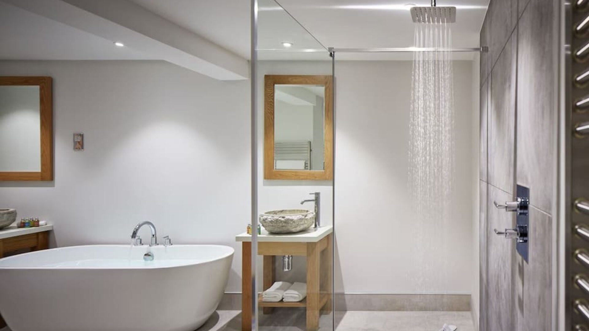 Guest bathroom with shower and tub at Barnett Hill Hotel.
