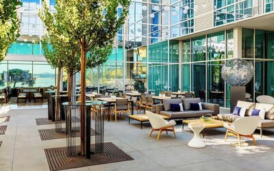 Al fresco dining with ample seats at AC Hotel By Marriott SFO/Oyster Point Waterfront.