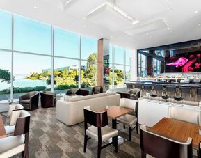 Lounge and coworking area at AC Hotel By Marriott SFO/Oyster Point Waterfront.