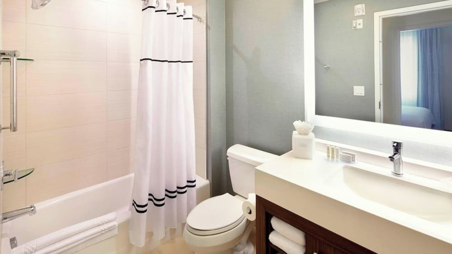 Guest bathroom with shower and tub at Residence Inn Secaucus.