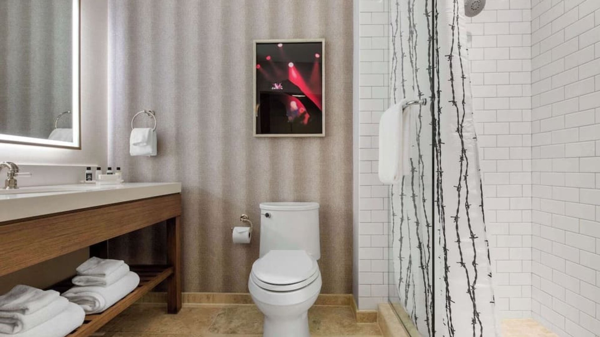 Guest bathroom with shower at Cambria Hotel Nashville Downtown.