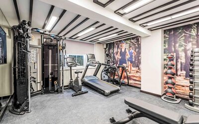 Fully equipped fitness center at Mercure London Hyde Park Hotel.