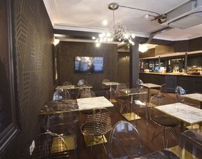 Dining area at The Pack And Carriage London Hotel.