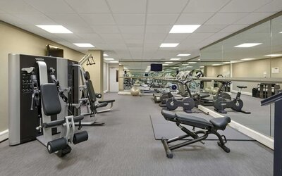 Fully equipped fitness center at Hyatt Place London Heathrow Airport.