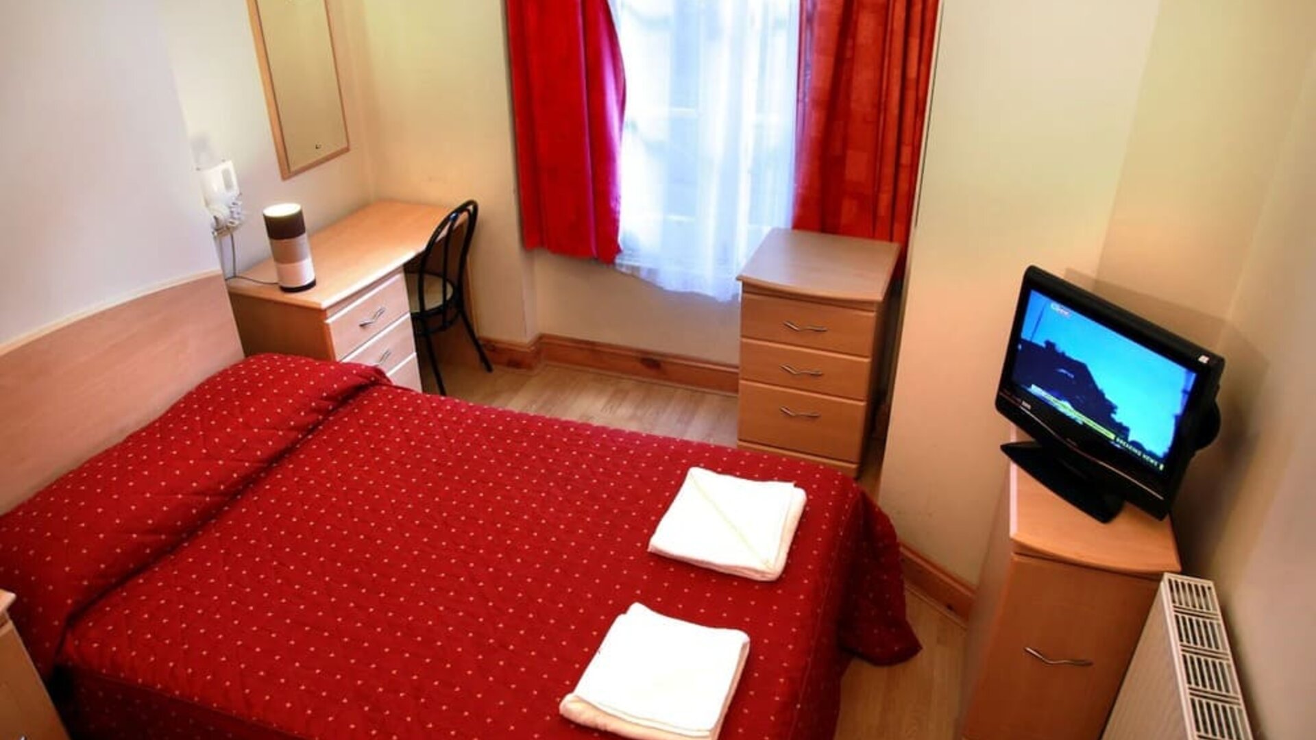 Comfortable day use room with work desk and private bathroom at Elmwood Hotel.
