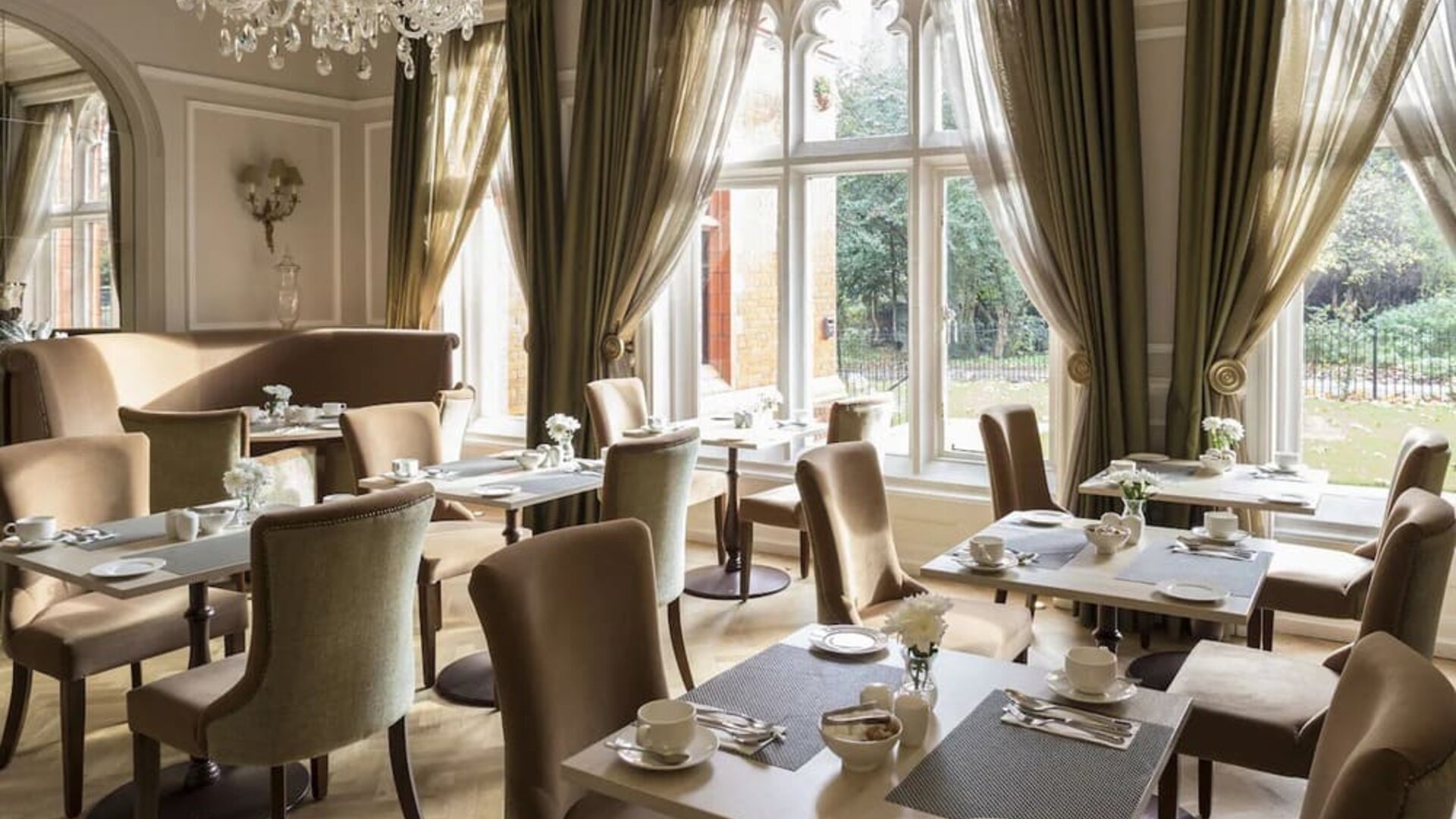 Elegant dining area with floor to ceiling windows at St Paul's Hotel.