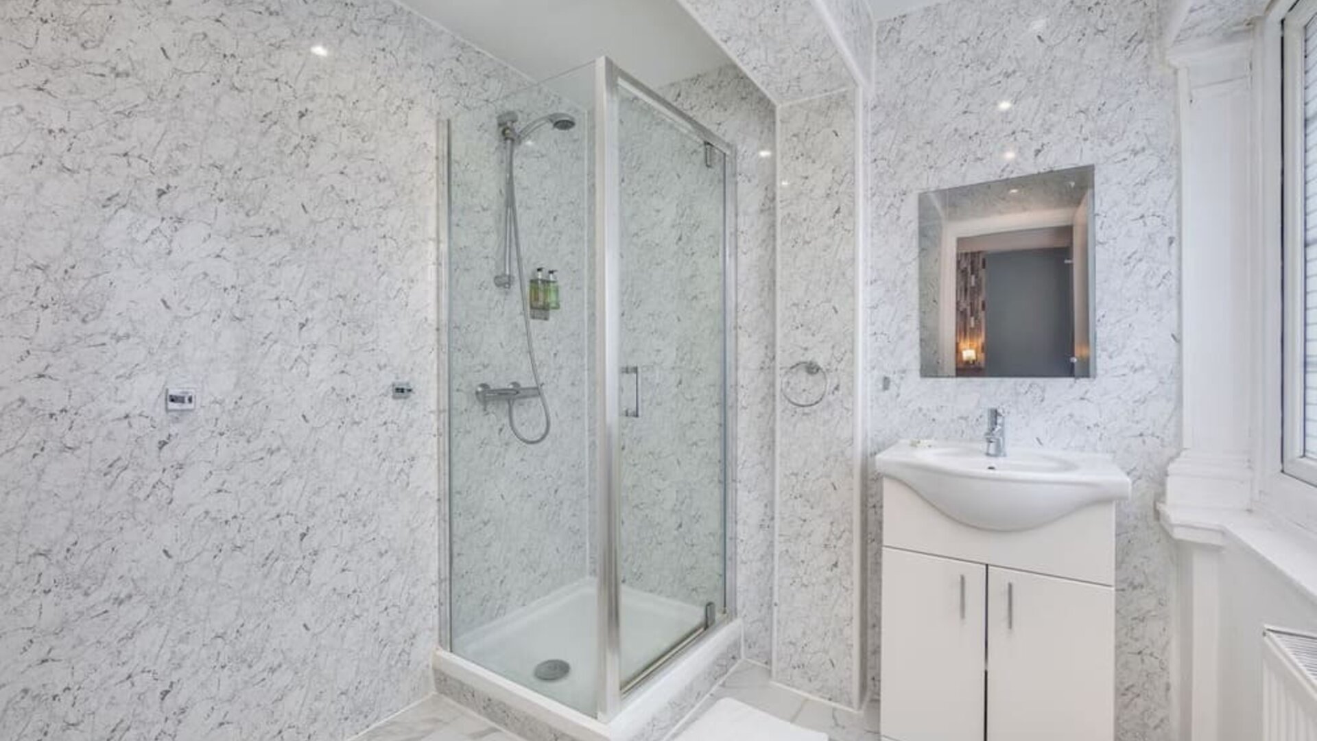 Guest bathroom with shower at King Solomon Hotel.