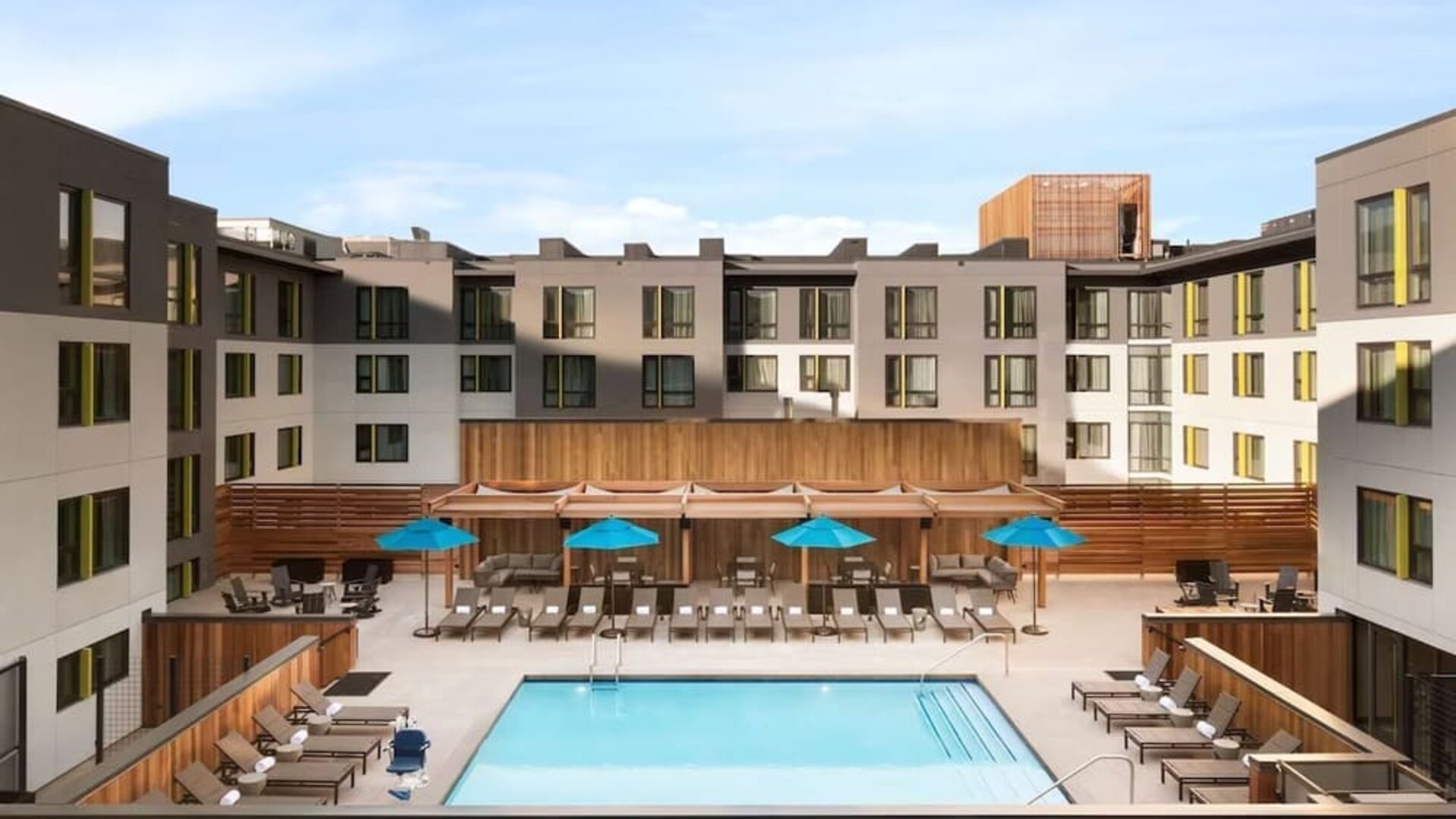 Loungers around outdoor pool at Embassy Suites Boulder.
