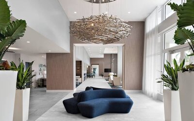 Lobby and coworking lounge at Courtyard Delray Beach.
