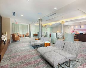 Lobby and coworking lounge at Courtyard By Marriott Santa Ana Orange County.