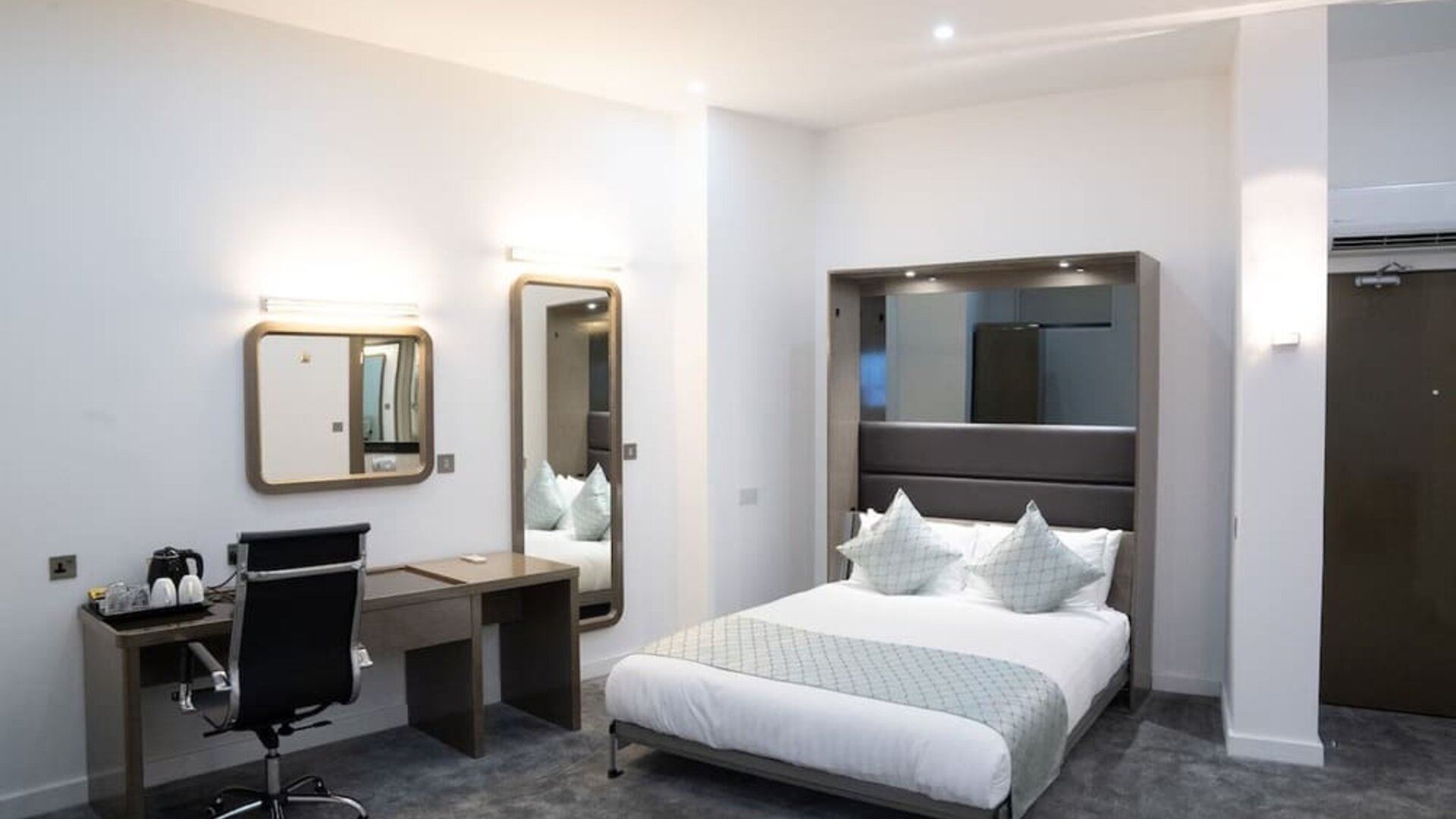 Bright and spacious day use room with work desk at Atrium Hotel Heathrow.