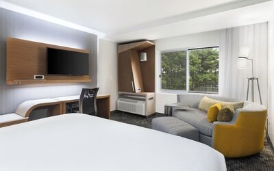 Day use room with sofa and work desk at Courtyard By Marriott Ruston.